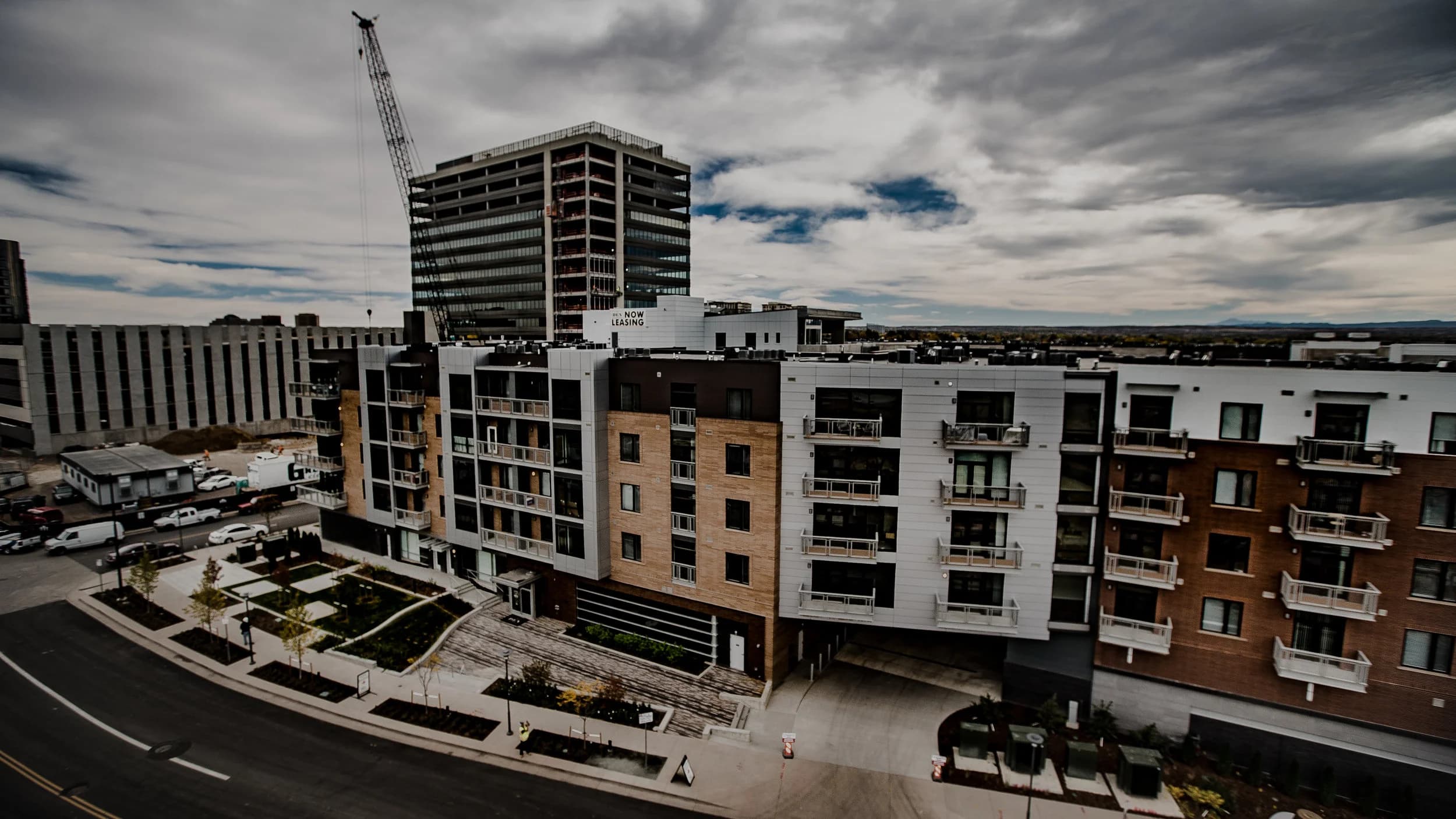 Multi-family development under construction with tower cranes