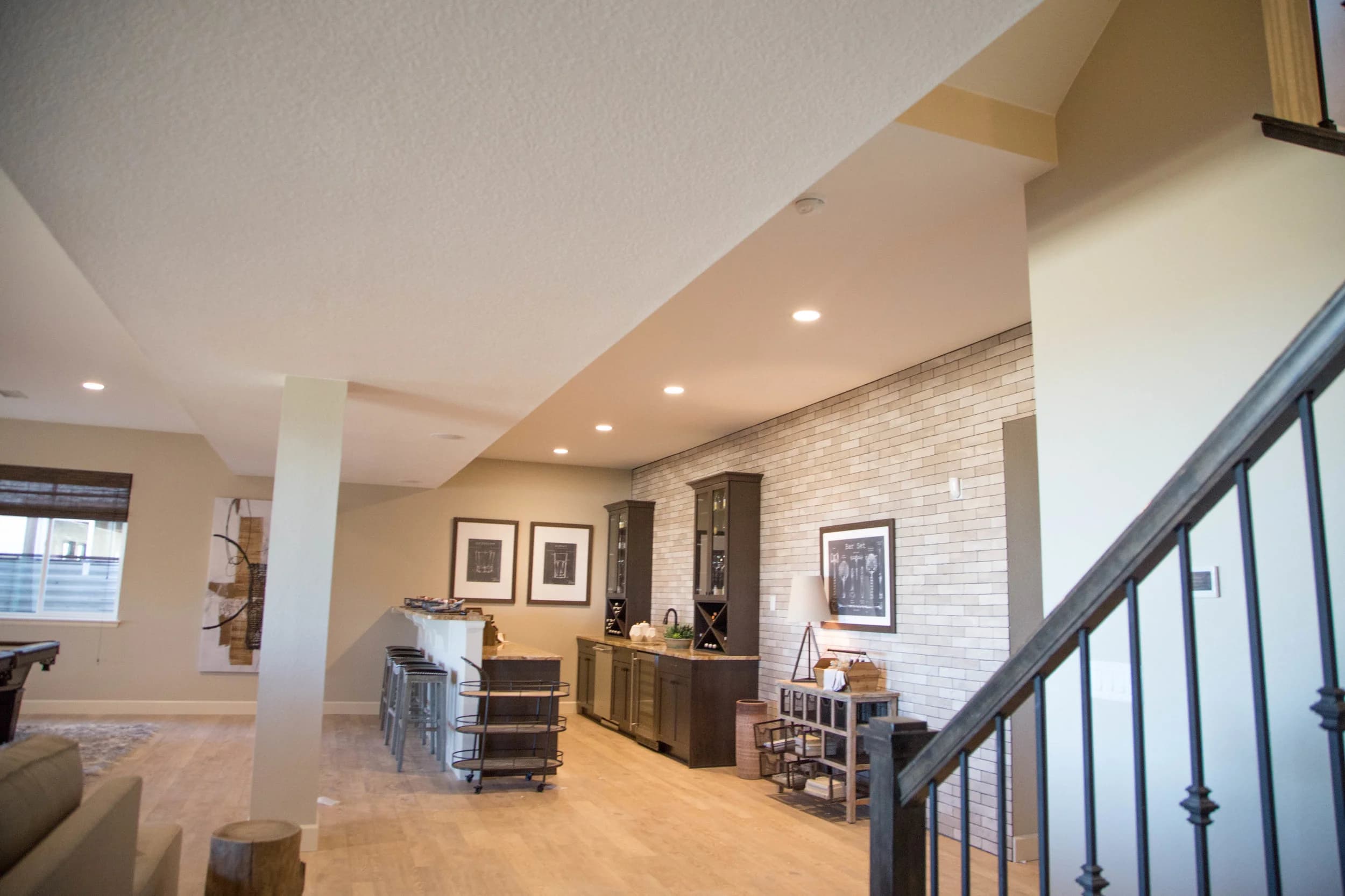 Open floor plan with staircase and recessed lighting