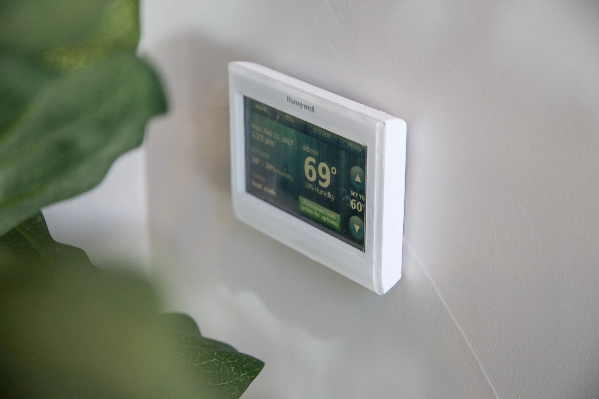 Smart thermostat set to 69 degrees, integrated with Intuity by Legrand