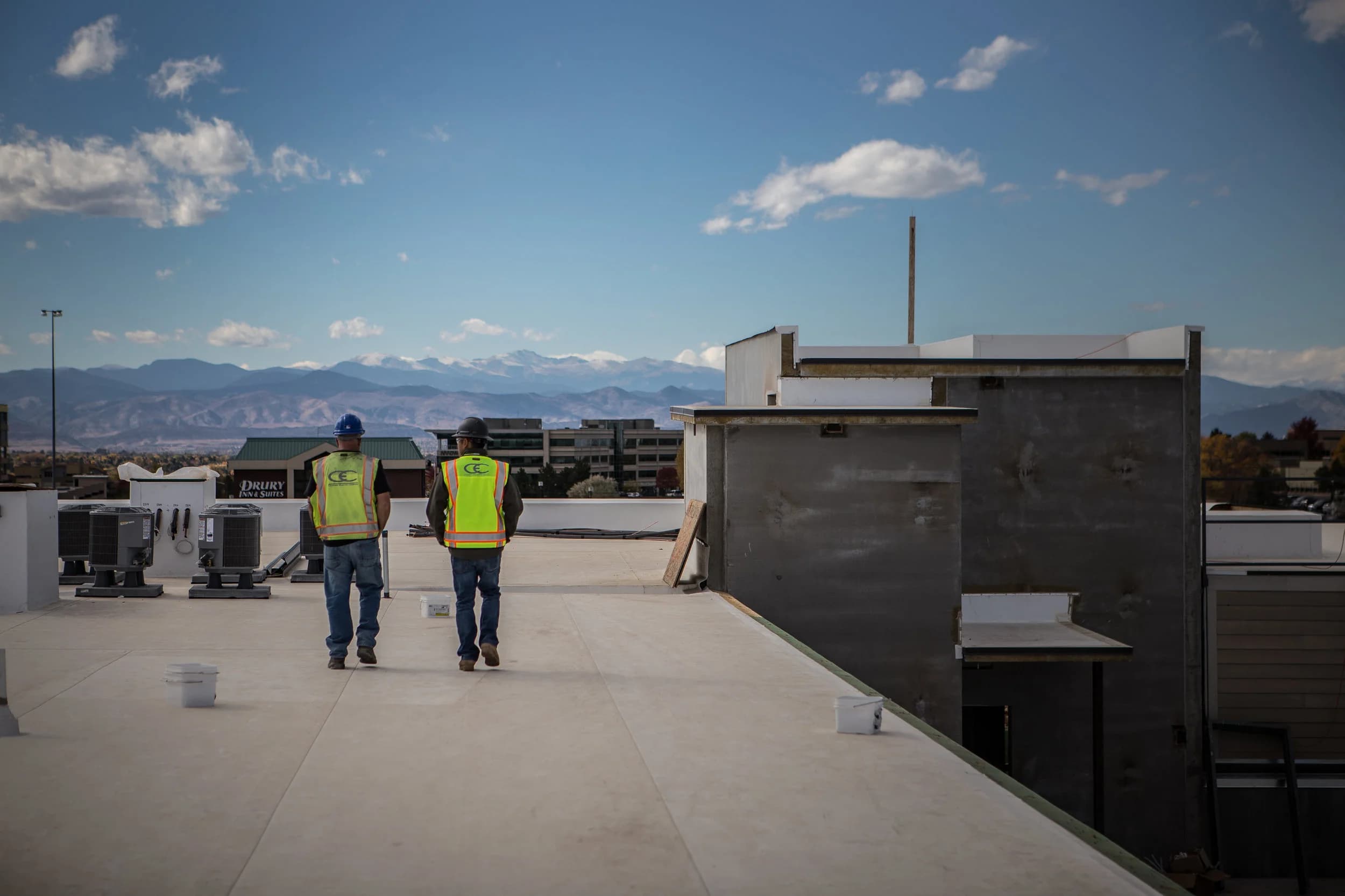 Crew on a rooftop with mountain views