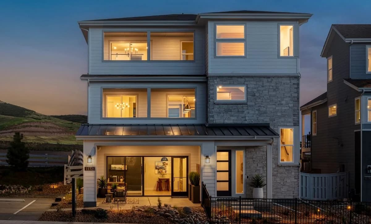 Model home exterior at dusk in the gated BackCountry community in Highlands Ranch