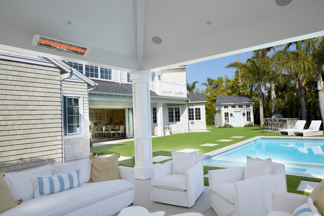 Covered patio and pool outdoor living space wired for lighting and sound
