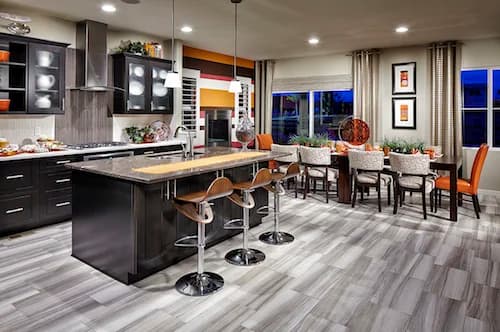 Open kitchen and dining area with a dark island